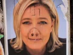 A Defaced FN Campaign Poster: Marine Le Pen still divides political opinion. Photo by Andy Hay via Flickr.