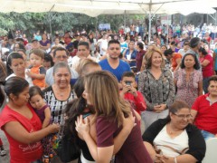 Salvadoran First Lady, Vanda Pignato, receives a hug from a supporter at an International Women's Day event in San Salvador. Photo by Jamie Stark.